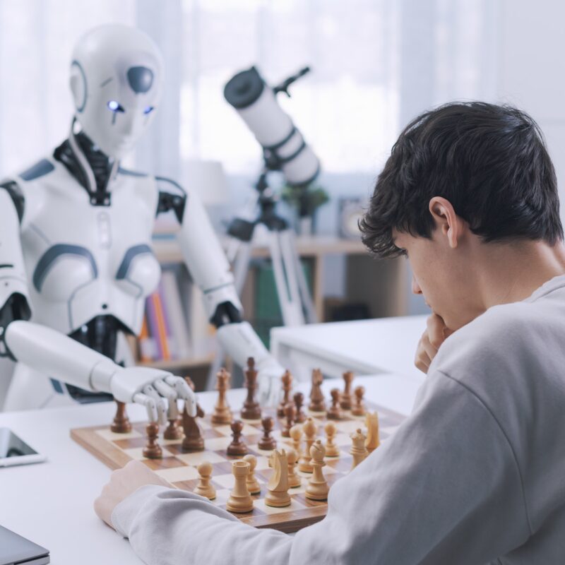 Fun and games: boy matches wits with robot