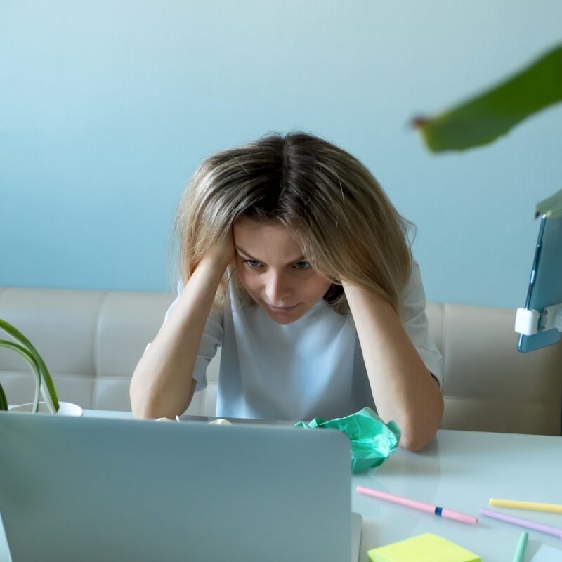 Woman freelancer in stress. No ideas. Emotional burnout at work